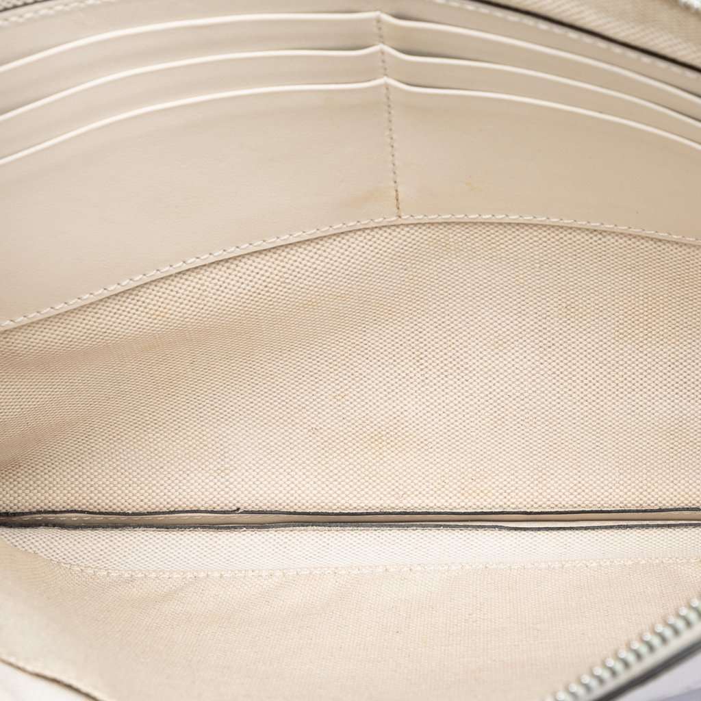 Gucci GG Embossed Perforated Calfskin Wristlet Clutch White Leather Very good condition - Model View