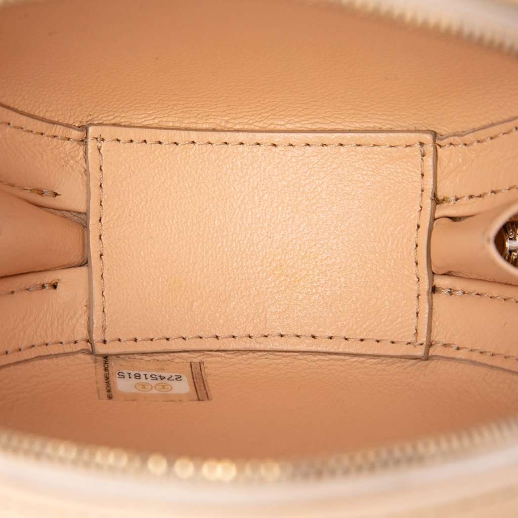 Chanel Stitched Calfskin Logo Strass and Pearl Chain Round Crossbody Beige Leather Very good condition - Model View