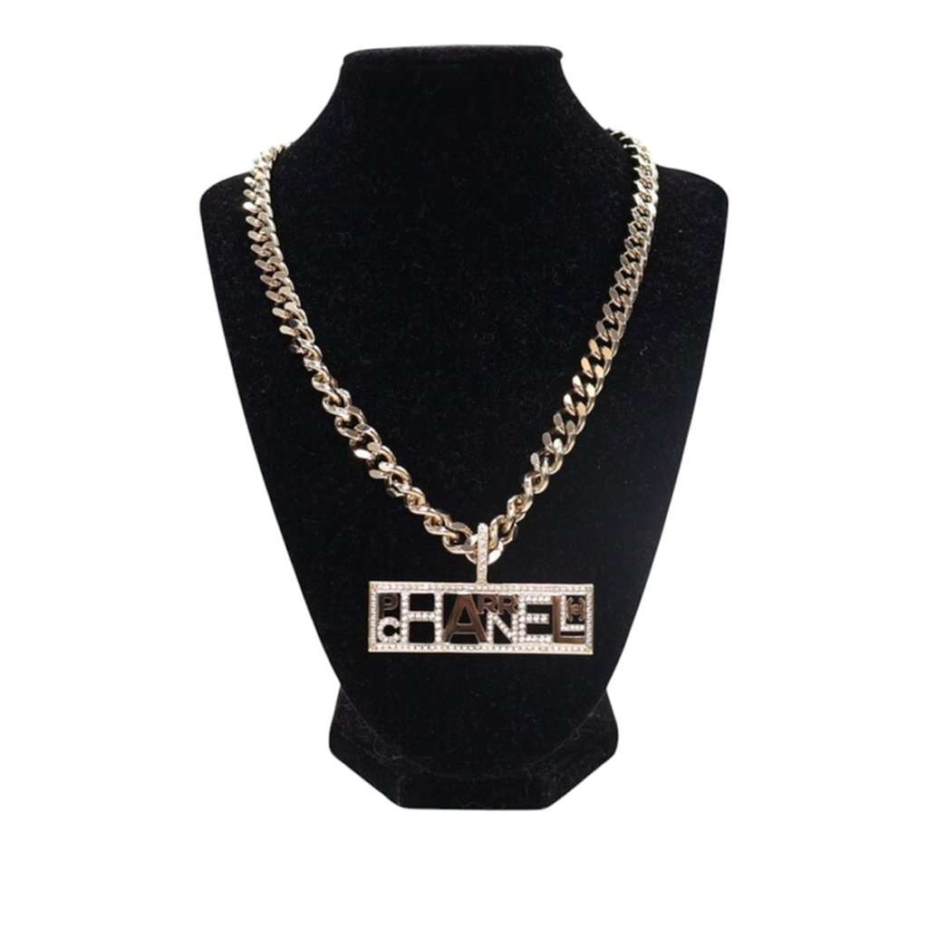 Chanel Pharrell Gold Plated Strass Chain Letters Pendant Necklace Gold Metal Very good condition - Front View