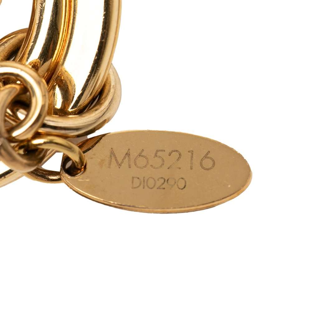 Louis Vuitton Gold Plated LV Facettes Bag Charm and Key Holder Gold Metal Very good condition - Model View