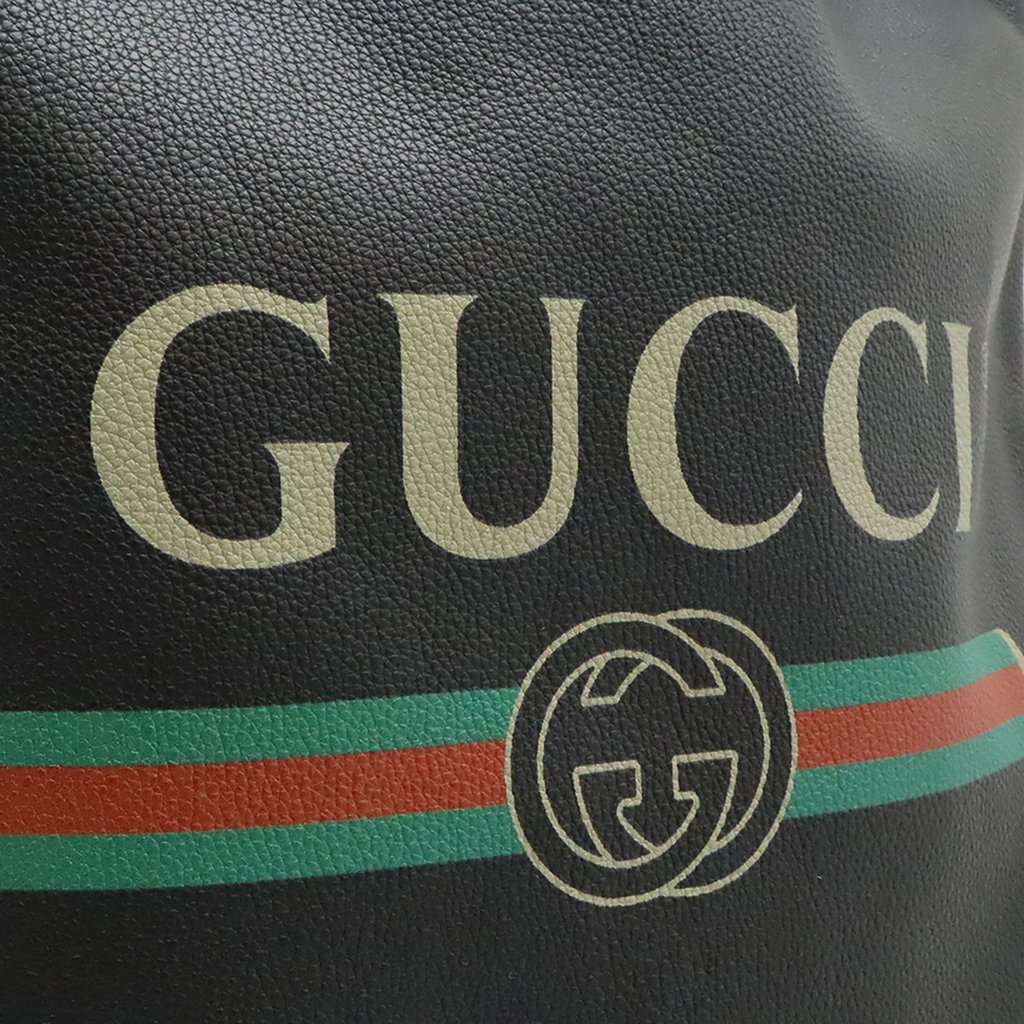 Gucci Grained Calfskin Web Logo Drawstring Backpack Black Leather Very good condition - Model View