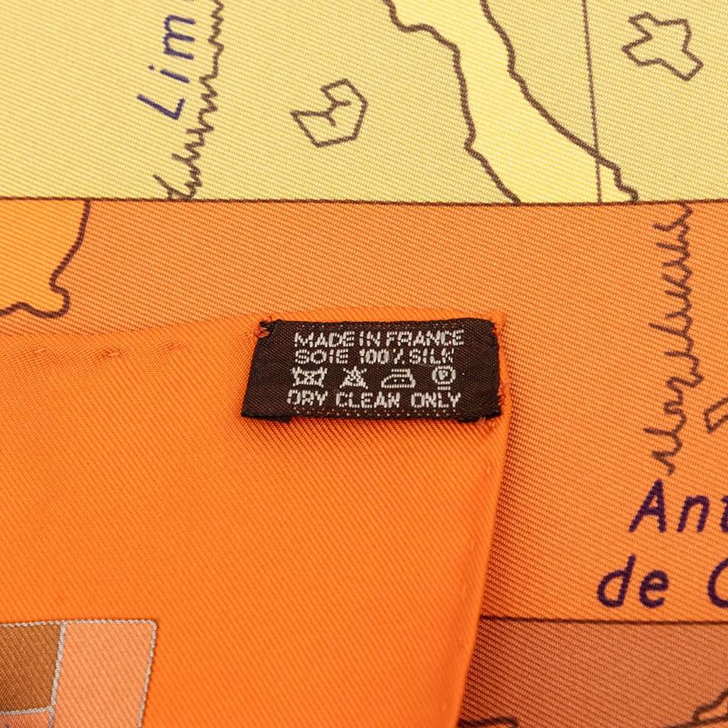 Hermès Le Monde Est Vaste Silk Scarf 90 Orange Very good condition - Box View