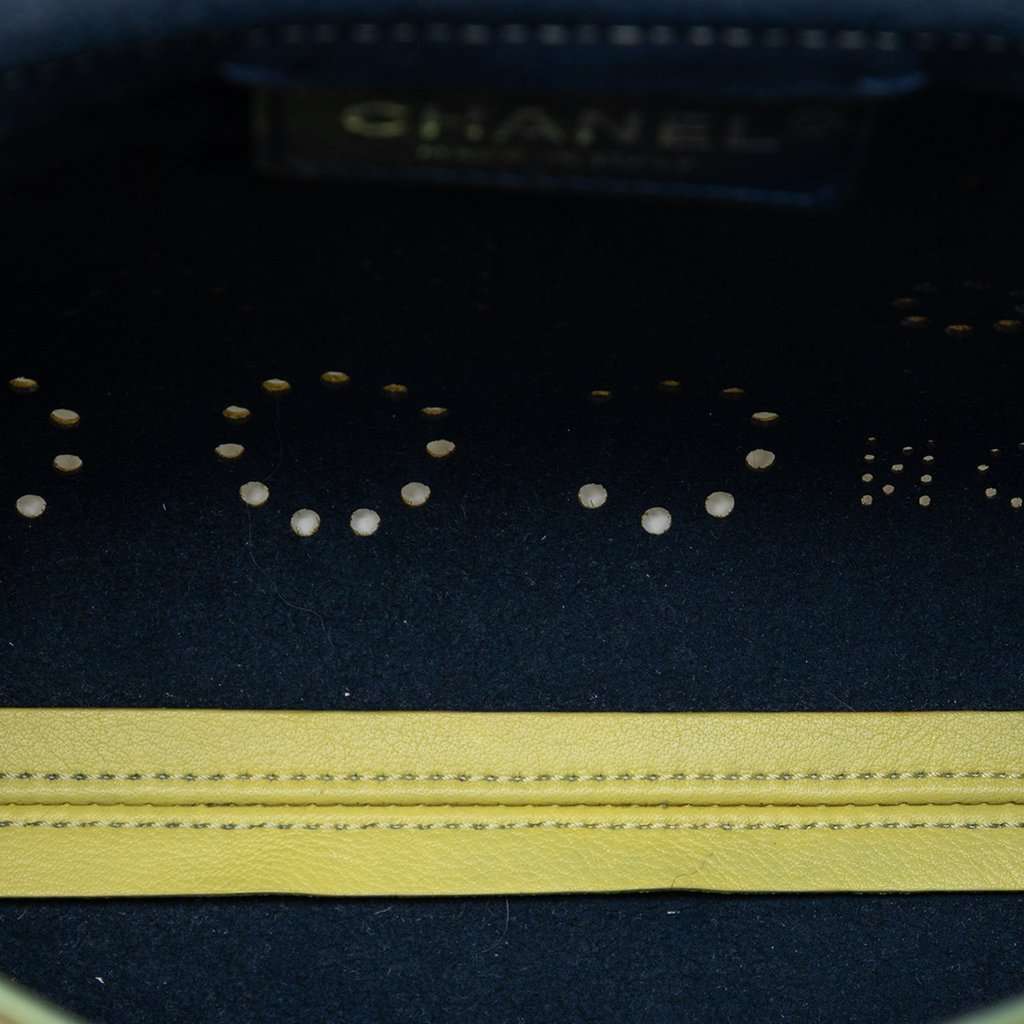 Chanel Perforated Calfskin Logo Eyelet Flap Yellow Leather Very good condition - Model View