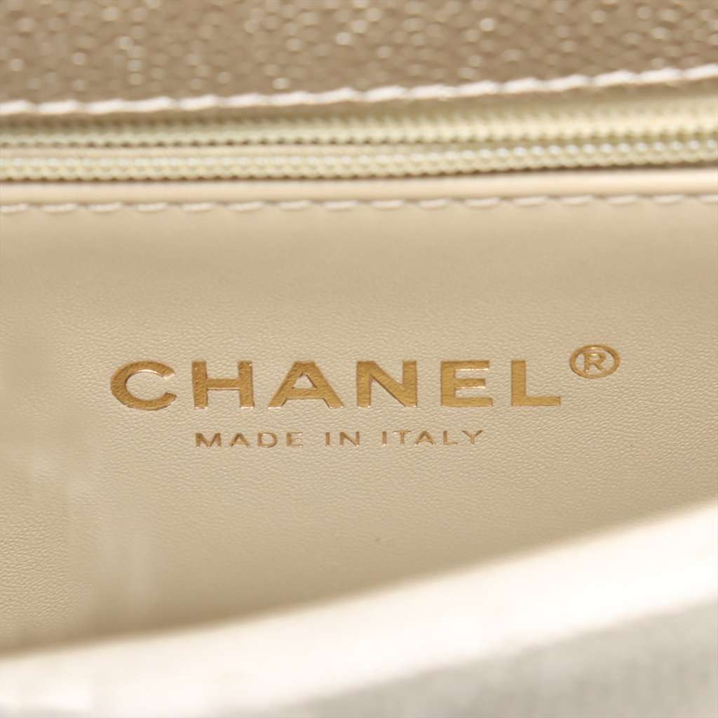 Chanel Mini Quilted Caviar Coco Top Handle Bag Gold Leather Never worn - Model View