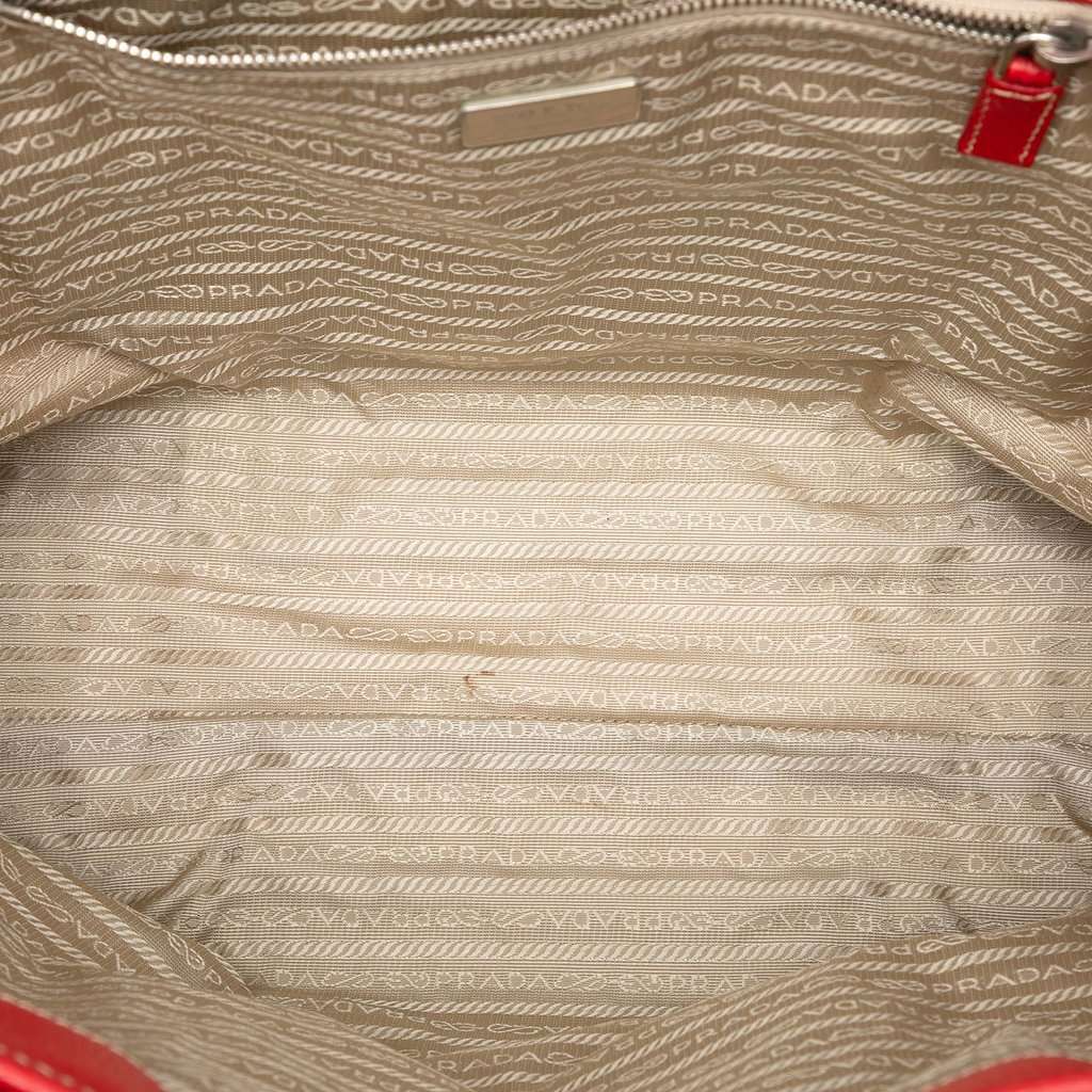 Prada Studded Leather Trimmed Canvas Front Pocket Tote Beige Very good condition - Model View