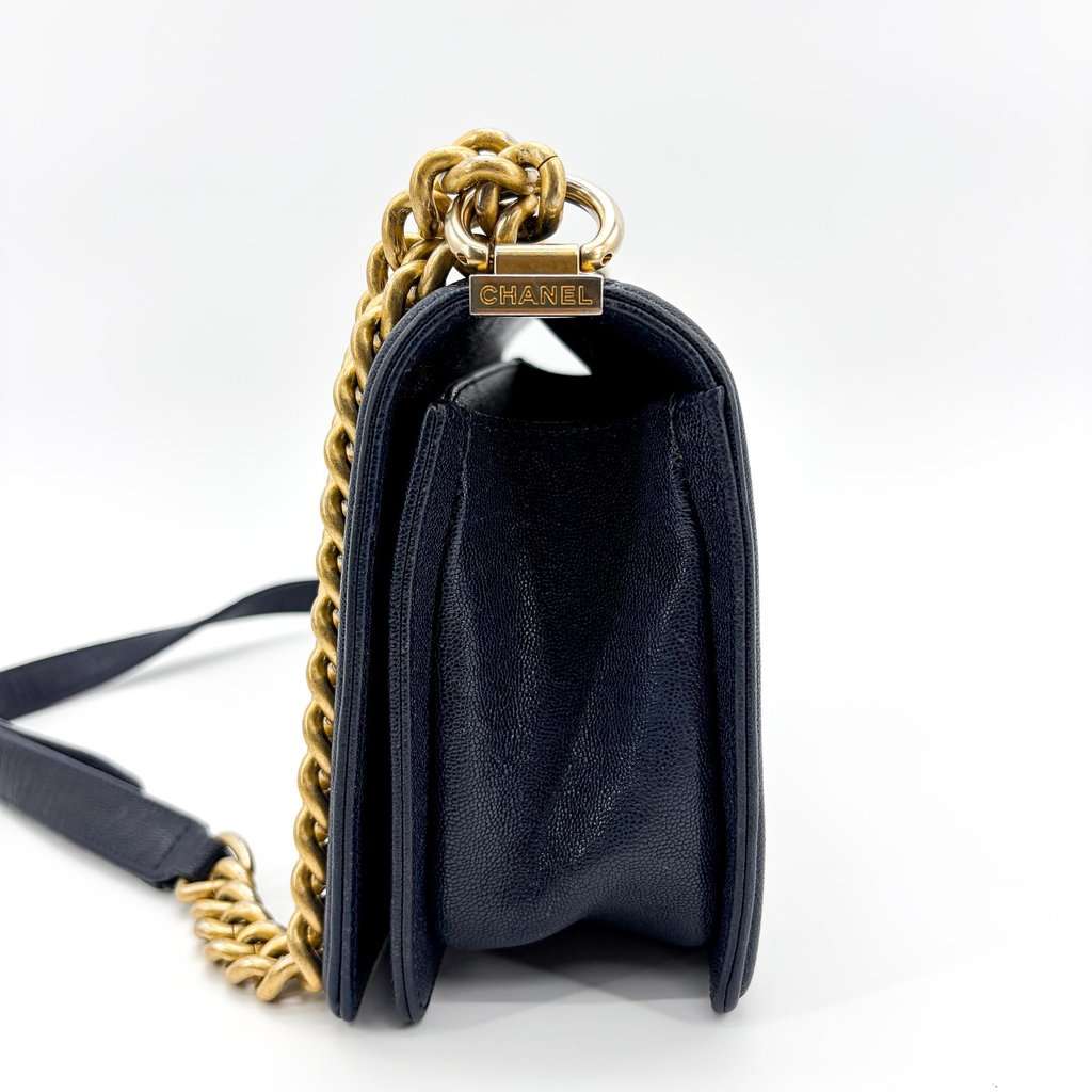 Chanel Boy Chanel Flap Bag Medium Navy Caviar Vintage Gold Hardware Navy Leather Good - Model View
