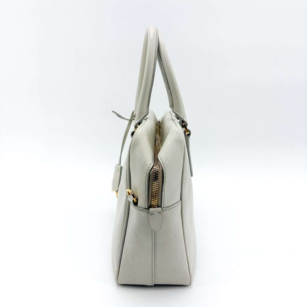 Prada Saffiano Lux Top Handle Bag Talco White Gold Leather Good - Model View