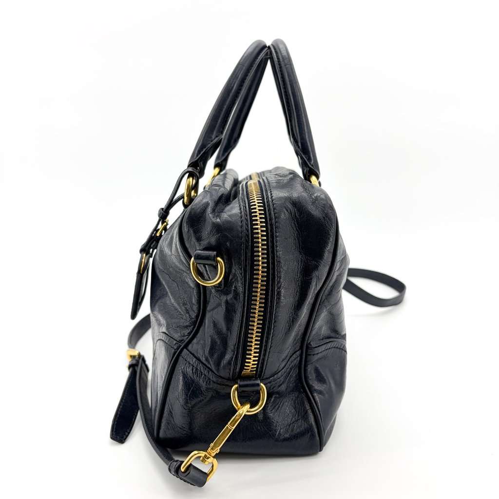 Prada Vitello Shine Boston Bag Navy Gold Hardware Gold Leather Good - Model View