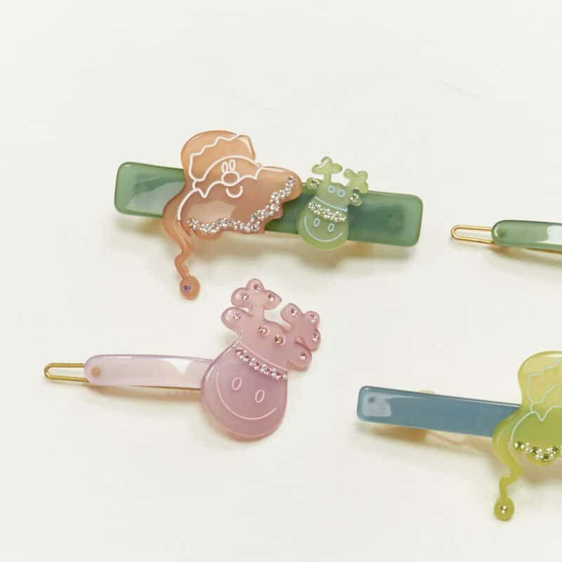 Unsigned Santa Hair Clips Green Plastic Never worn - Inside View
