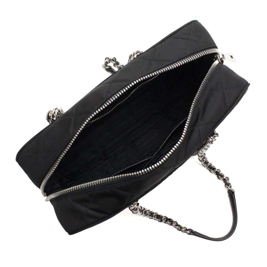 Prada Prada Black Quilted Tessuto Nylon Shoulder Bag Chain Handles Lock and Key Black Leather Never worn - Model View