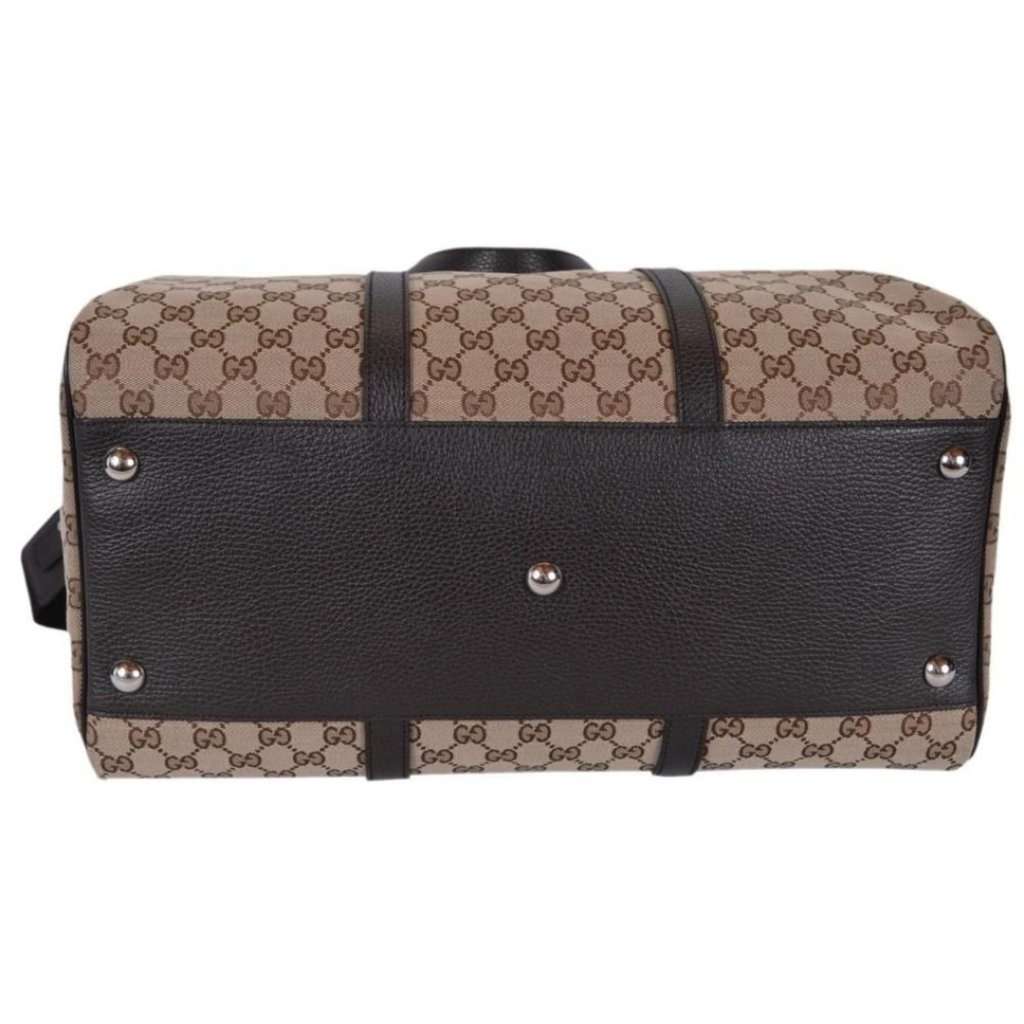 Gucci Gucci Large GG Logo Beige Canvas Brown Leather Strap Duffle Bag Brown Canvas Never worn - Model View