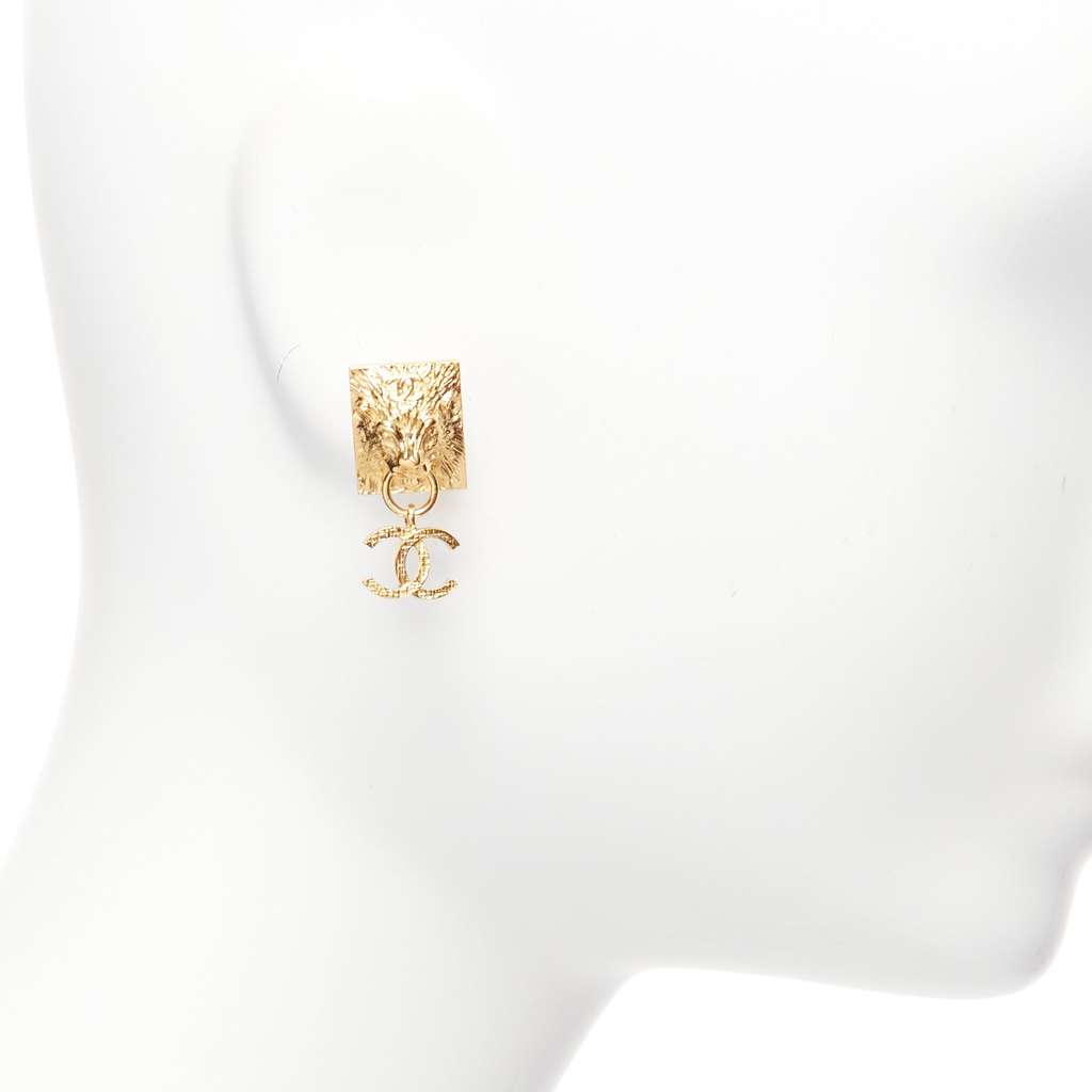 Chanel Lion Head Earrings Gold Metal Never worn - Model View