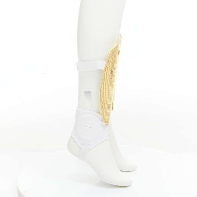 Gucci GG Shin Guards Gold Metal Fair - Model View