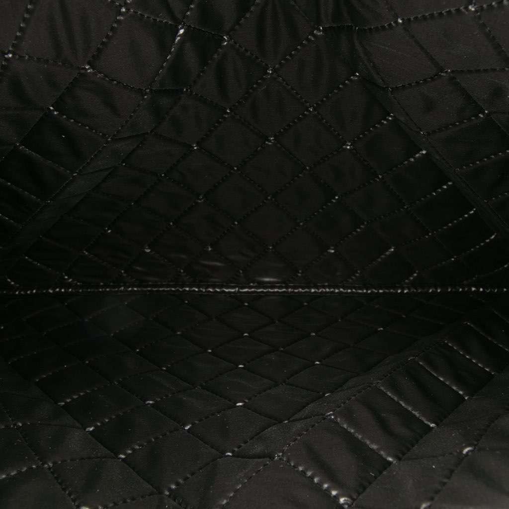 Chanel Large Quilted Lambskin Camellia O Case Clutch Black Leather Good - Model View