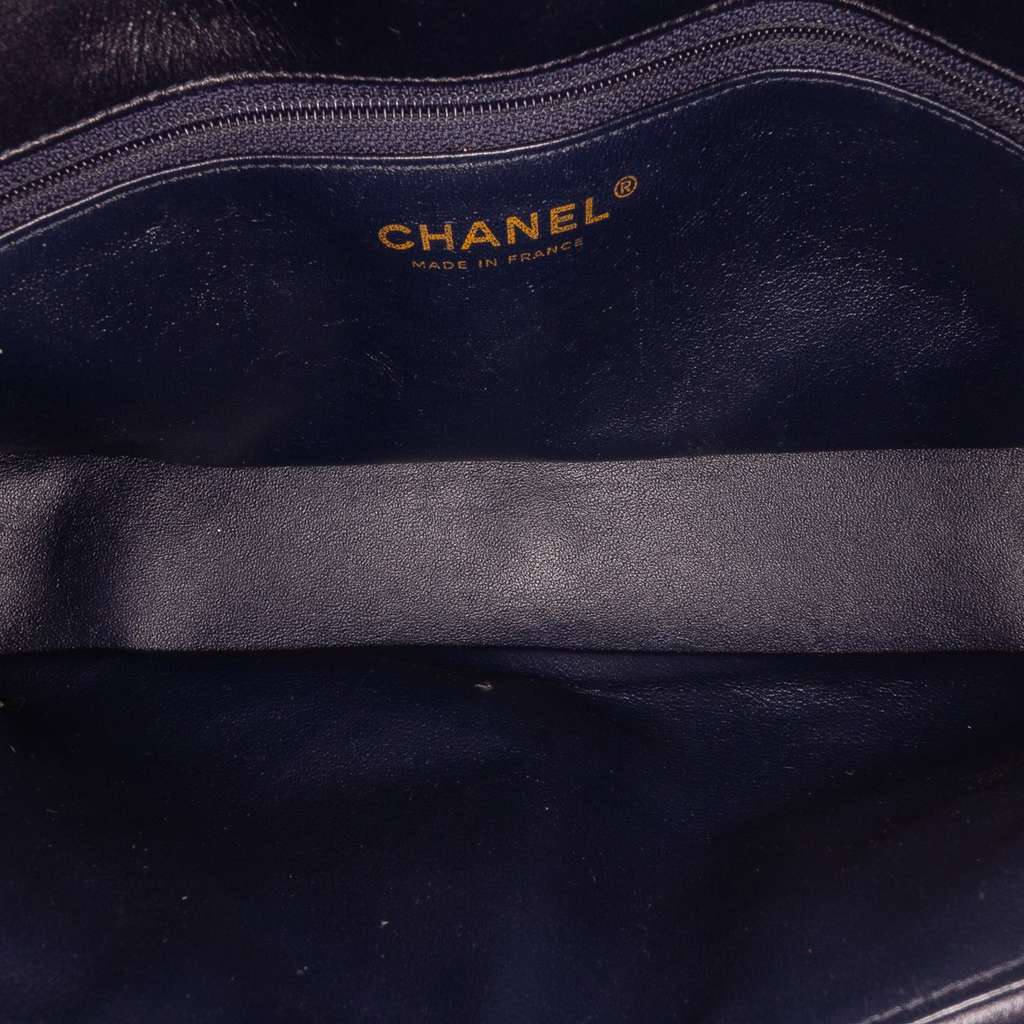 Chanel CC Horizontal Quilted Lambskin Double Flap Black Leather Fair - Model View