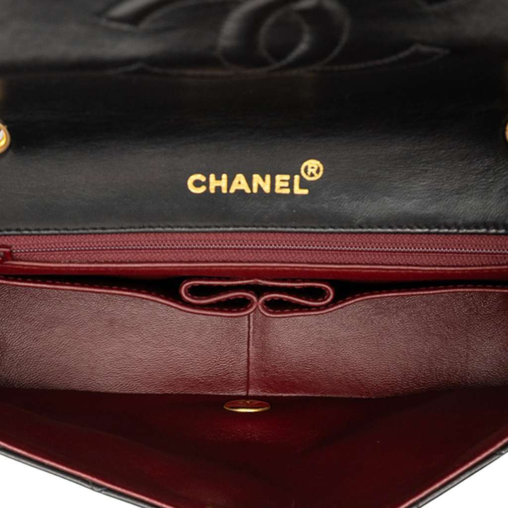 Chanel Medium Quilted Lambskin Full Flap Black Leather Good - Model View
