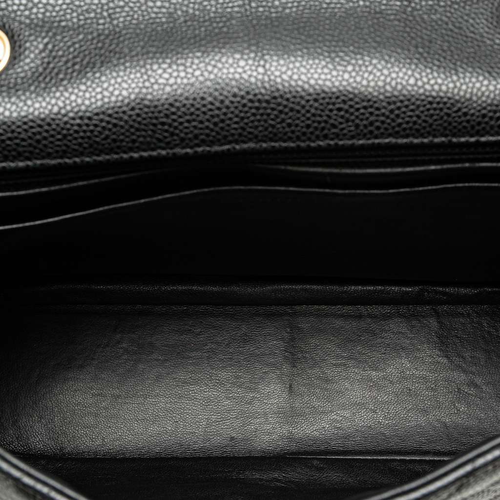 Chanel Jumbo Classic Caviar Single Flap Black Leather Good - Model View