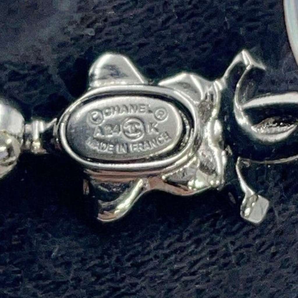 Chanel CC Silver Plated Crystal Star Push Back Earrings Silver Metal Very good - Model View