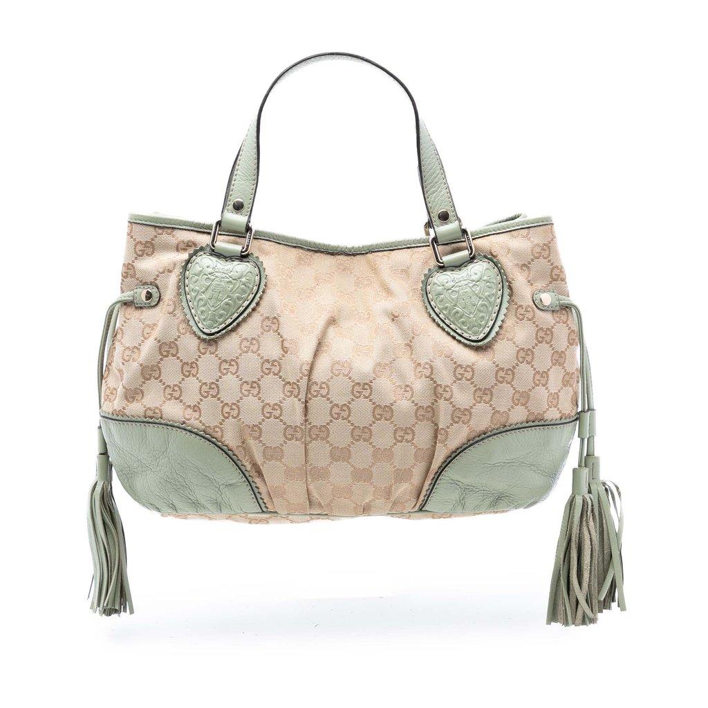 Gucci حقيبة تريبيكا الصغيرة المصنوعة من قماش GG
