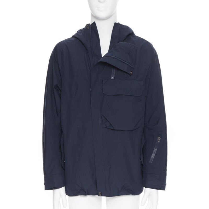 The North Face سترة واقية من الرياح بغطاء رأس أزرق