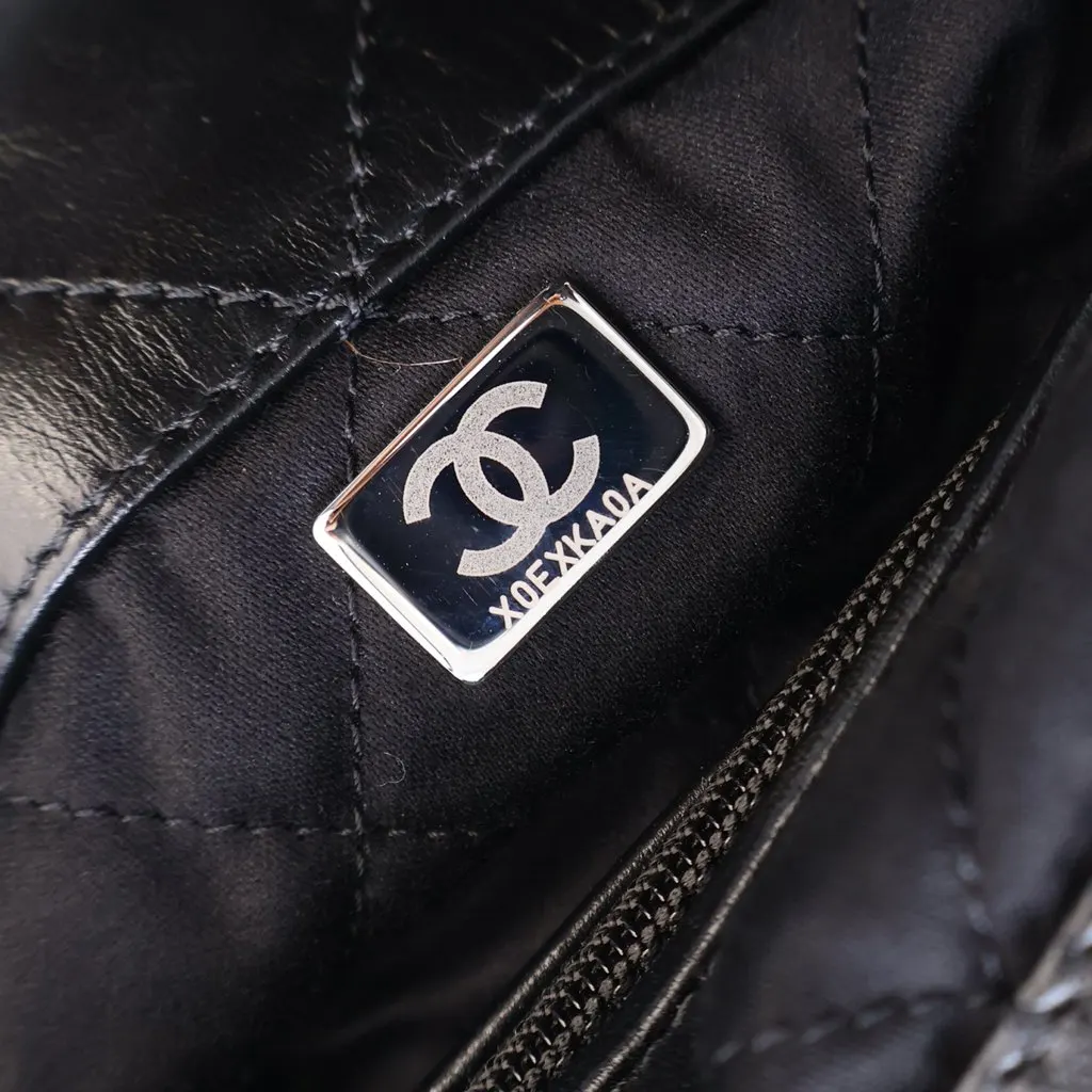 Chanel Large Quilted Shiny Calfskin 22 Backpack Black Leather Very good - Model View