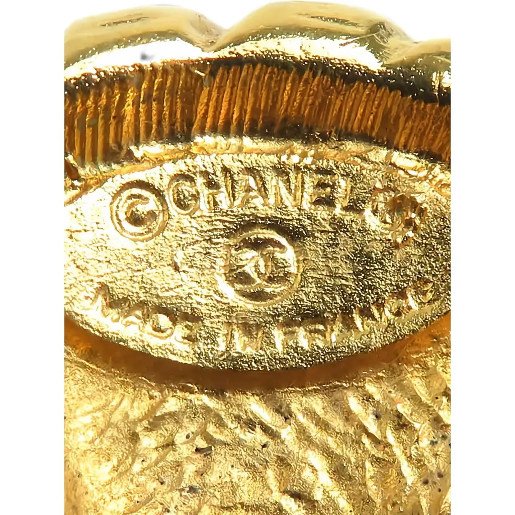 Chanel CC Gold Plated Sunburst Round Clip On Earrings Gold Metal Very good - Model View