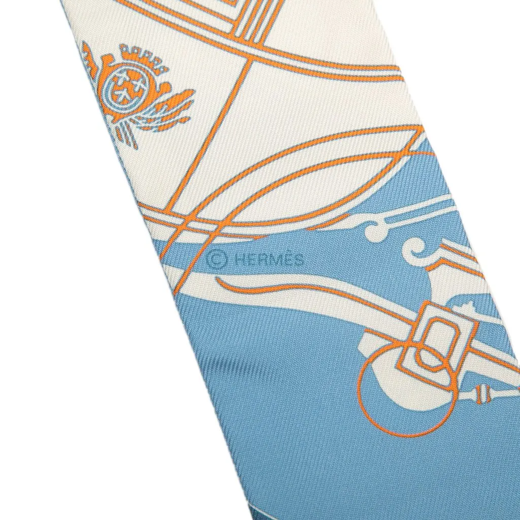 Hermès Ex Libris Silk Twilly Scarf Blue Silk Never worn - Model View