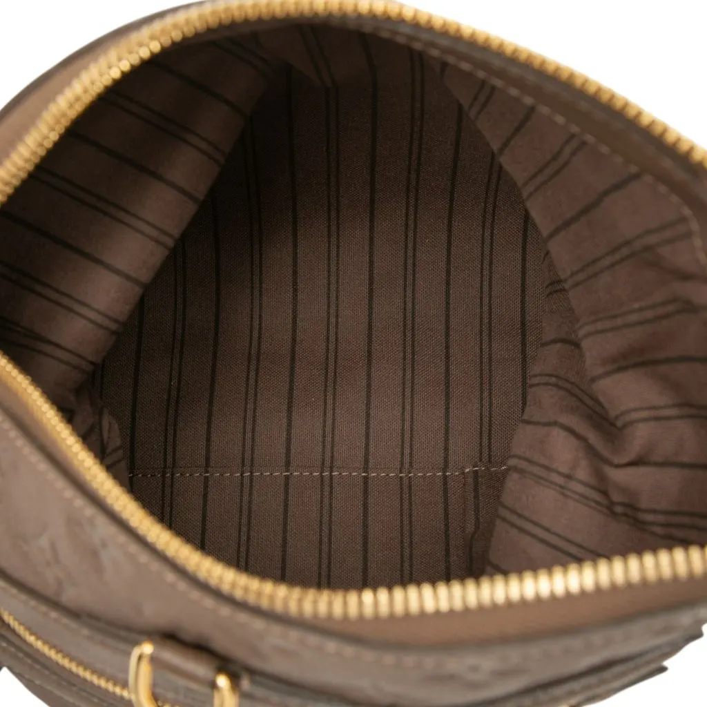 Louis Vuitton Monogram Empreinte Petillante Brown Leather Good - Model View
