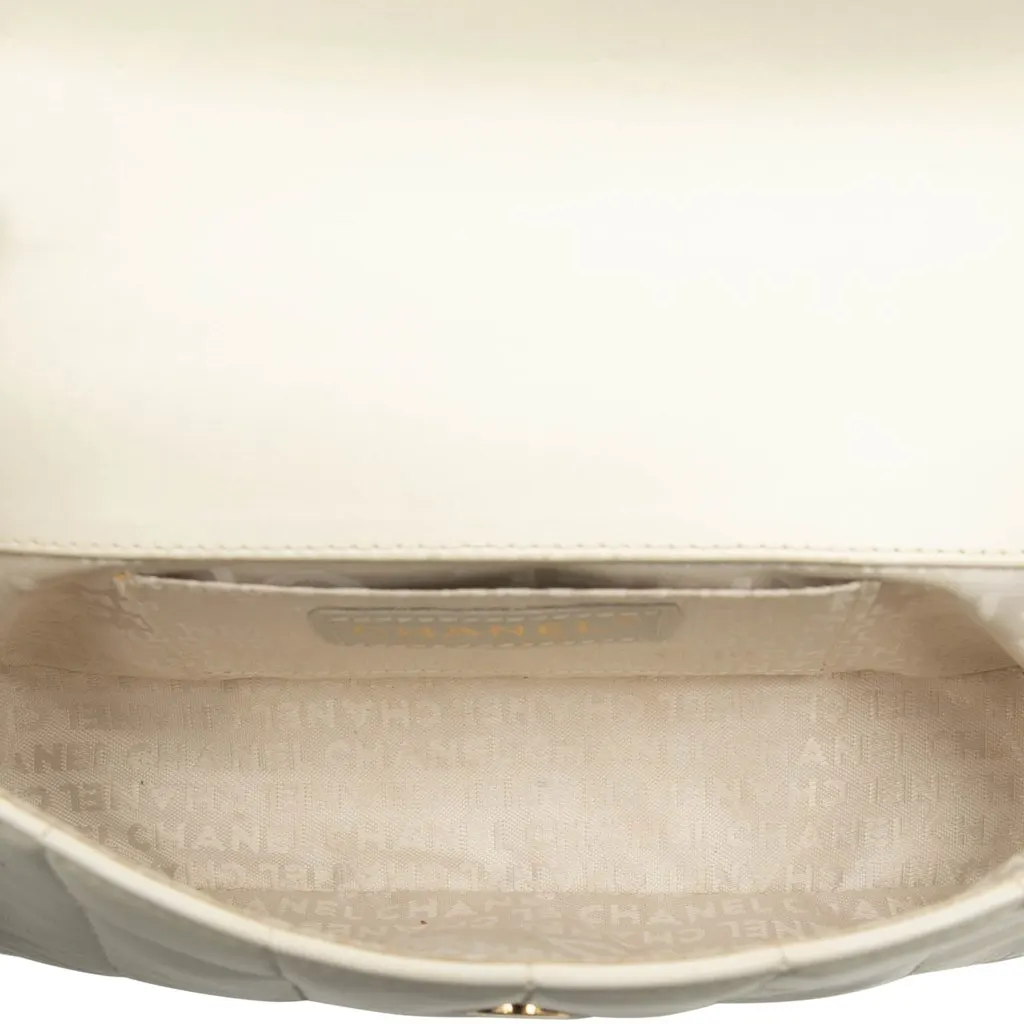 Chanel Mini Lambskin Chocolate Bar Camellia Flap White Leather Good - Model View