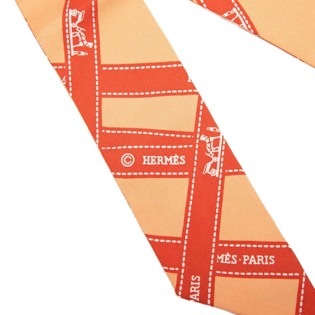 Hermès Bolduc Silk Twilly Scarf Orange Silk Never worn - Model View