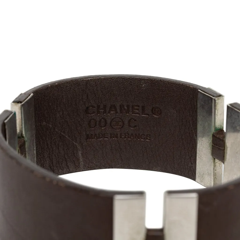 Chanel Debossed Leather and Brass Logo Cuff Bracelet Brown Leather Good - Model View