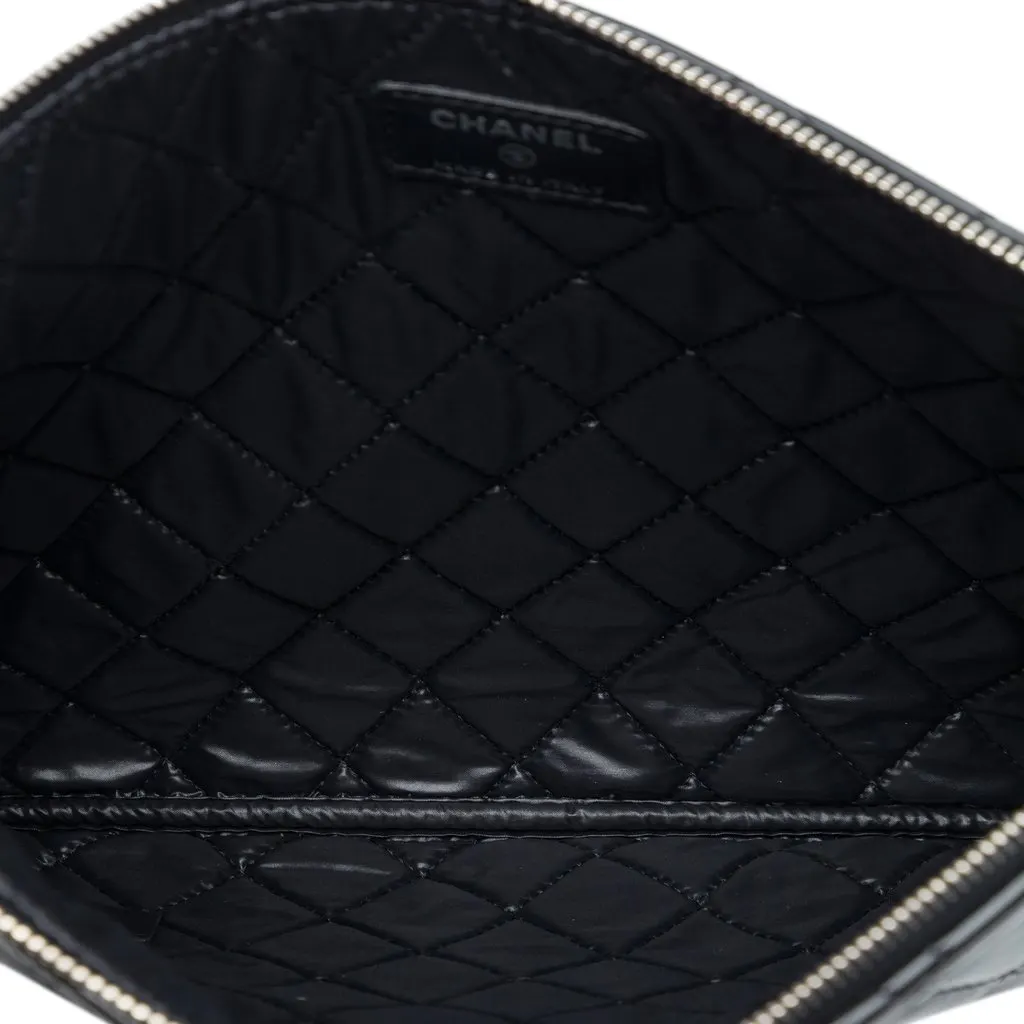 Chanel Medium Quilted Patent O Case Clutch Black Leather Very good - Model View