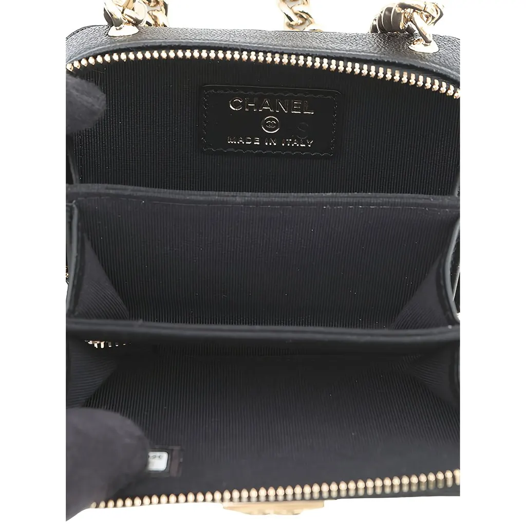 Chanel Mini Chevron Caviar Boy Clutch with Chain Black Leather Good - Model View