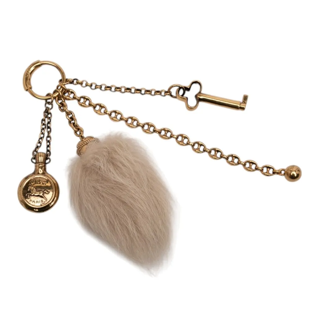 Chloé Gold Plated Chloe Symbols and Shearling Tail Bag Charm Gold Metal Never worn - Inside View