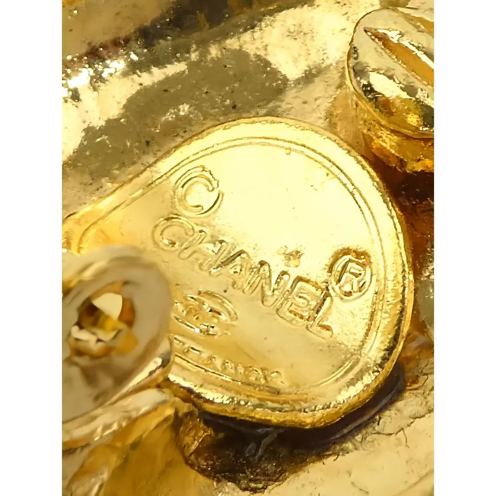 Chanel CC Gold Plated Sunburst Clip On Earrings Gold Metal Very good - Model View