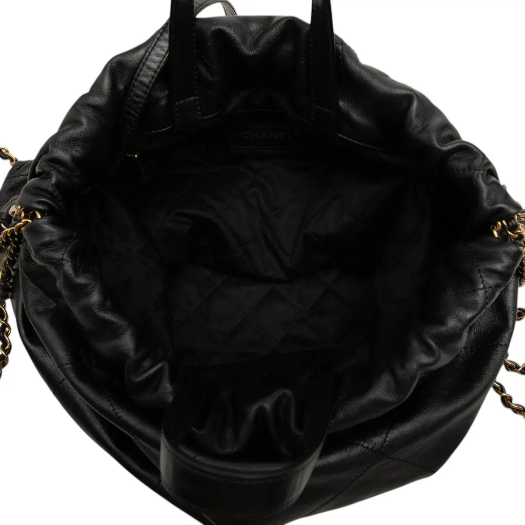 Chanel Large Quilted Shiny Calfskin 22 Backpack Black Leather Good - Model View