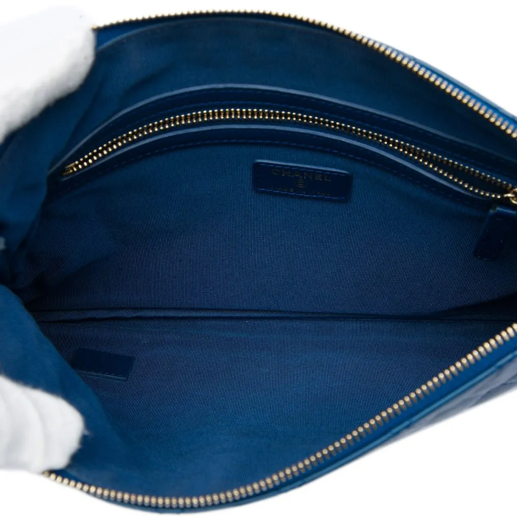 Chanel Medium Quilted Lambskin O Case Clutch Blue Leather Good - Model View