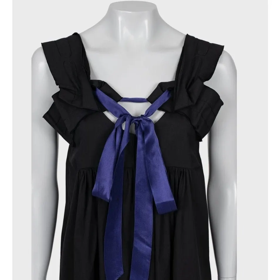 Miu Miu Chic Black Dress with Playful Purple Bow - Size 40/S Pre-owned Black Cotton Good - Model View