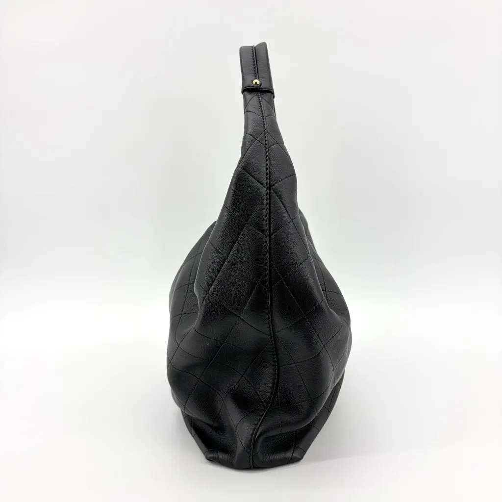Chanel Quilted CC Charm Hobo Bag Black Gold Hardware Black Leather Very good - Model View