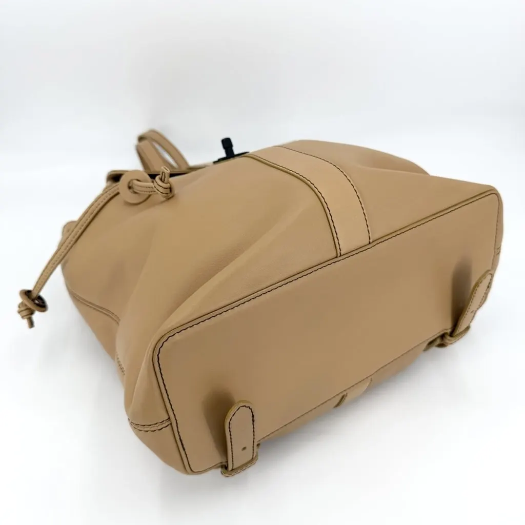 Chanel women's backpack with Coco Mark design, leather, brown, black hardware. Brown Leather Good - Inside View