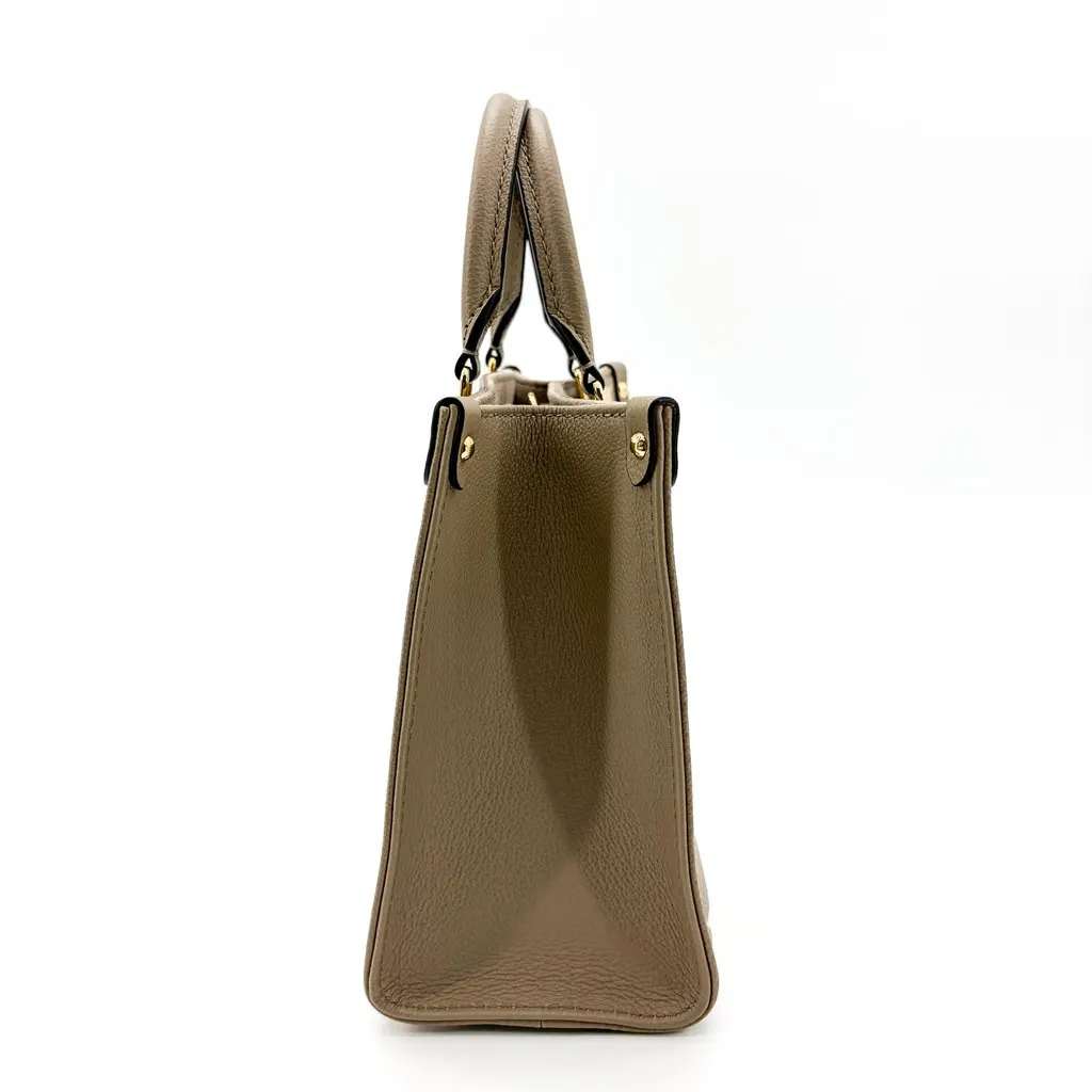 Louis Vuitton On the Go PM Monogram Empreinte Tourtrell Crème Beige Leather Good - Box View