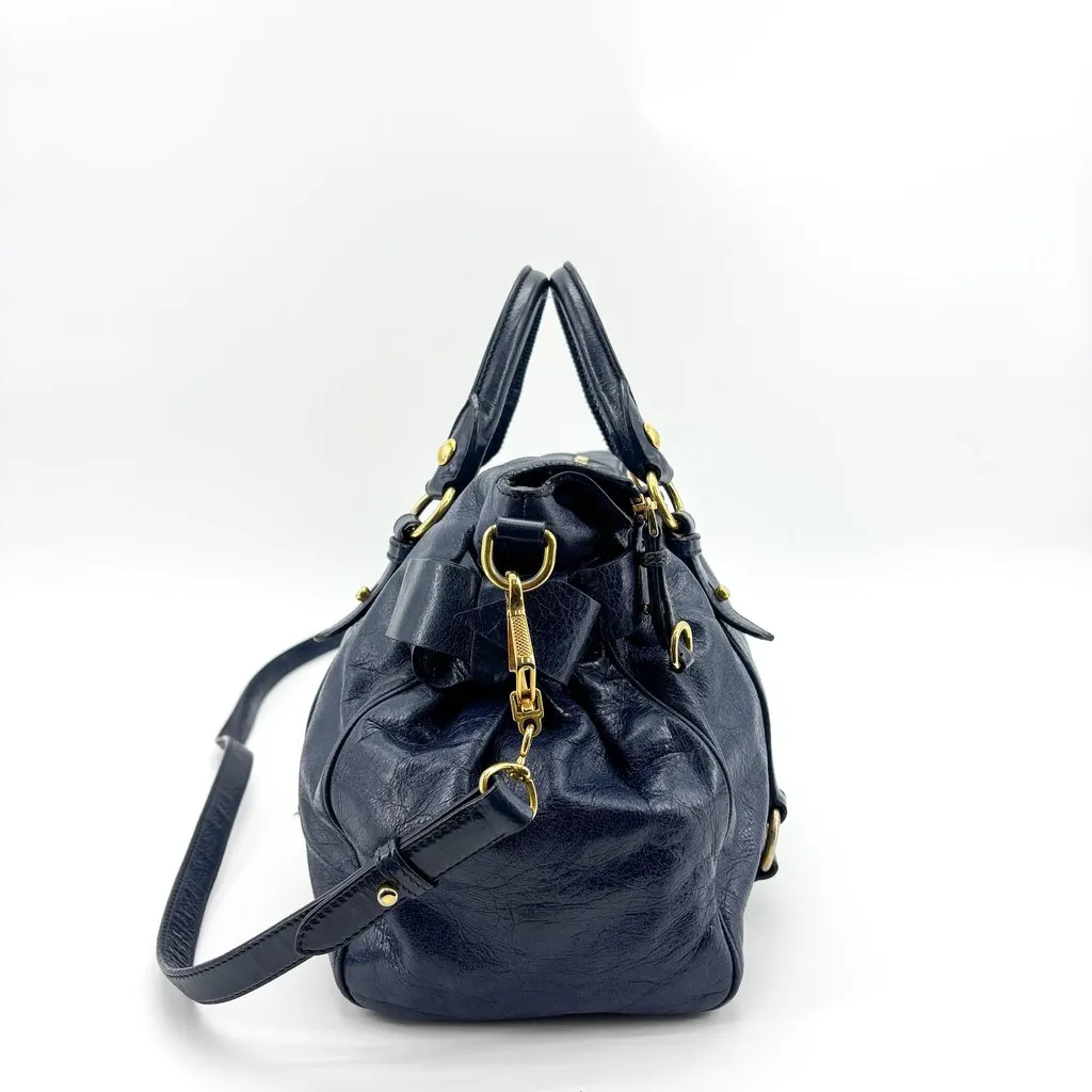 Miu Miu Vitello Lux Medium Bow Bag Navy Gold Leather Good - Model View