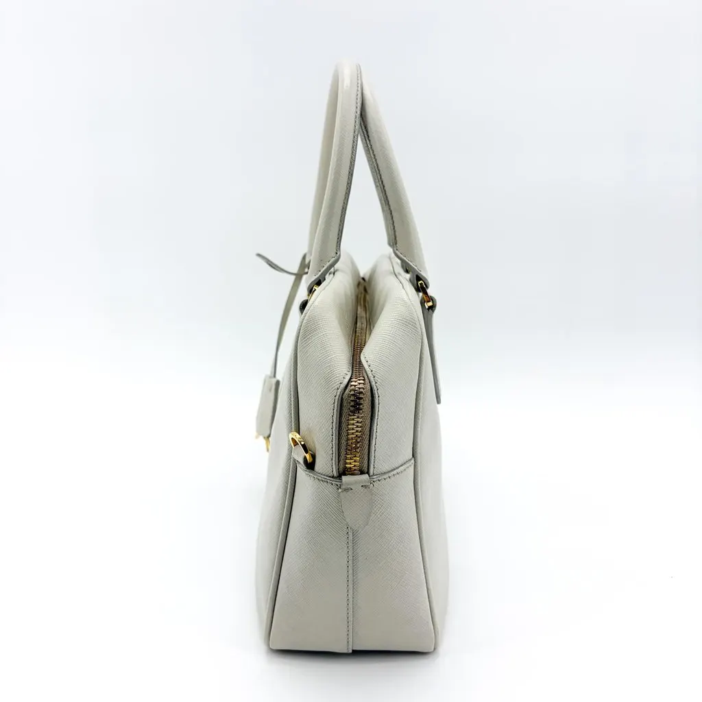 Prada Saffiano Lux Top Handle Bag Talco White Gold Leather Good - Model View