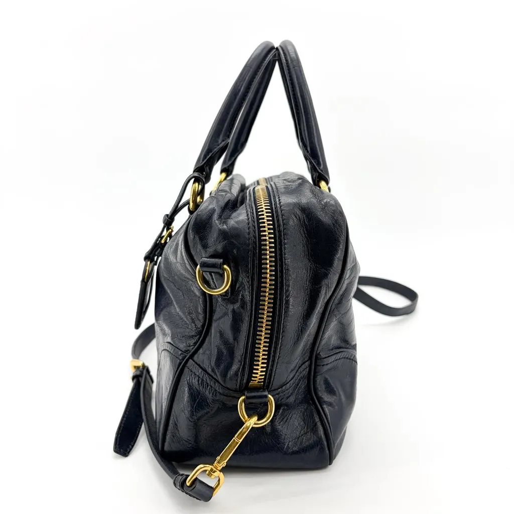 Prada Vitello Shine Boston Bag Navy Gold Hardware Gold Leather Good - Model View