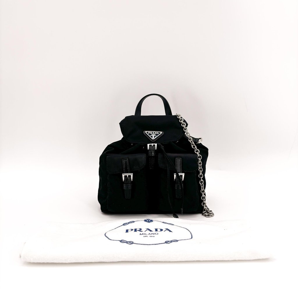 chain mini backpack Micro Key Honeycreeper Wear it as a backpack with padded nylon straps or switch to the detachable chain strap for a purse that moves through the day your way Prada Nylon Mini Chain Backpack