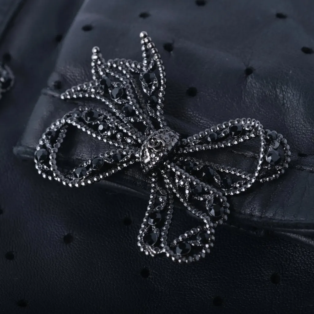 Chanel Black Perforated Lambskin Fingerless Gloves with Crystal Bow Detail - '20s Black Leather Good - Back View