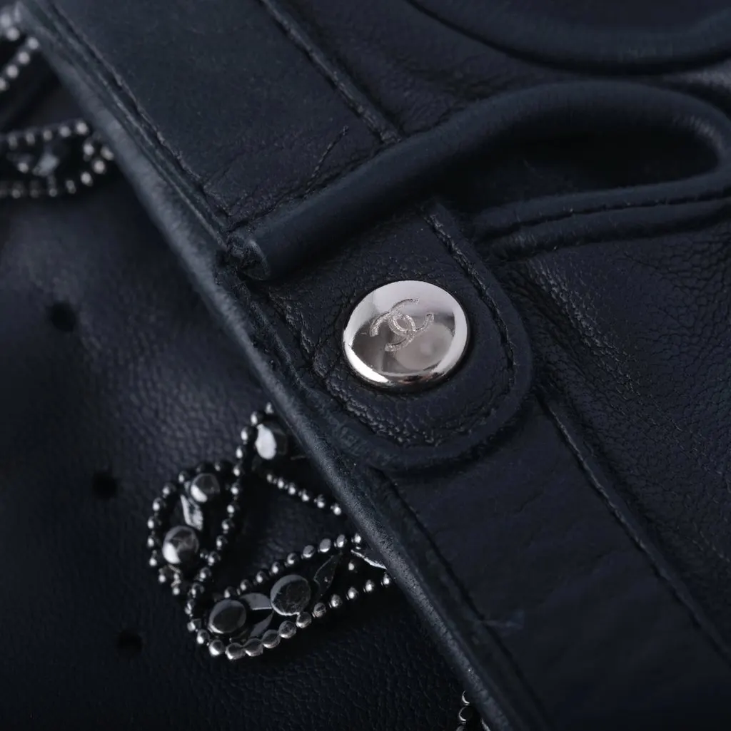 Chanel Black Perforated Lambskin Fingerless Gloves with Crystal Bow Detail - '20s Black Leather Good - Model View