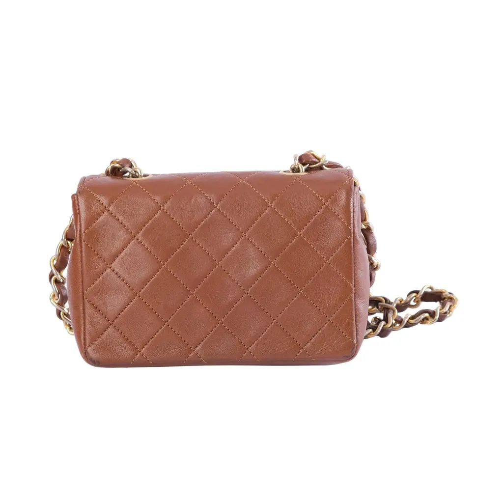 Chanel Extra Mini Quilted Leather Flap Crossbody Bag - '90s Brown Leather Good - Model View