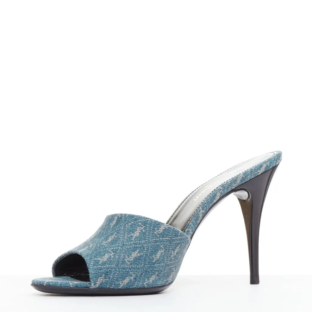 Saint Laurent Step into effortless Parisian chic with these YSL Cassandre mules, featuring all-over tonal YSL logo embroidery in washed denim and a sleek stiletto heel. Blue Denim Very good - Model View