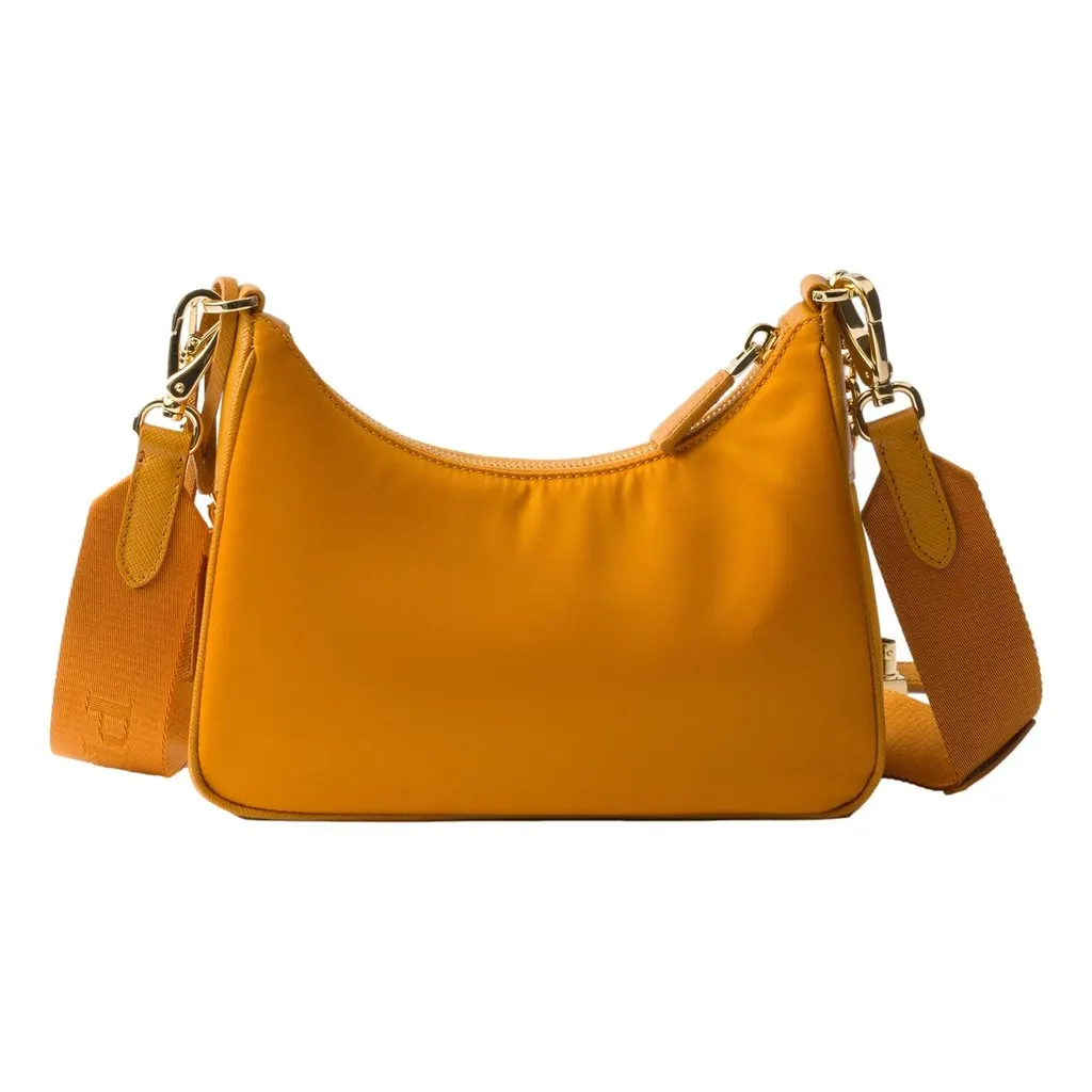 Prada Re-Edition 2005 Orange Re-Nylon and Saffiano Leather Shoulder Bag with Robot Charm Strap Orange Never worn - Model View
